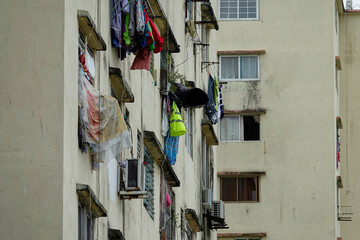 Drying laundry on window with rain protection in high-rise residential buildings