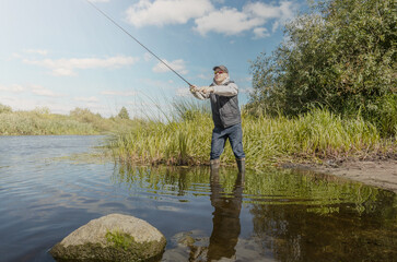 Angler throws a spinning rod.