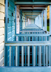 blue and white tunnel of beach huts