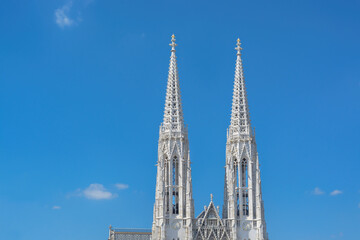 Towers of the Votivkirche in Vienna against the blue sky