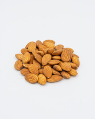 Peeled almonds on a white background