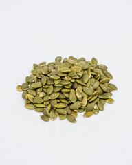 Pumpkin seeds peeled on white background