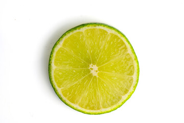 Fototapeta na wymiar sliced ​​lime on a white background with shadows