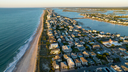 Aerial view of Wrightsville Beach, NC homes during a sunrise. © Red Lemon