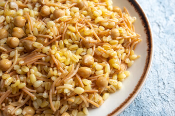 Traditional delicious Turkish food; bulgur pilaf with chickpea (Turkish name; nohutlu bulgur pilavi)
