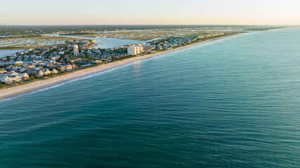 Aerial view of Wrightsville Beach, NC homes during a sunrise.