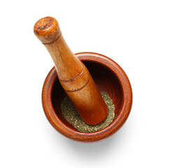 Wooden mortar and pestle with spices isolated on white background