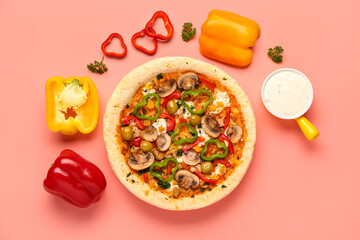 Vegetable pizza with ingredients and sauce on pink background