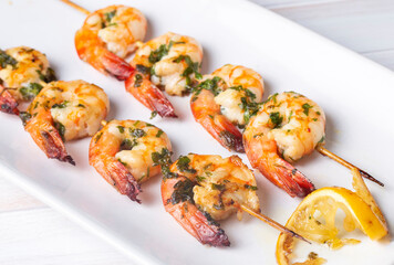Skewered grilled shrimp with sauce