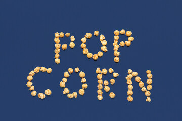 Text POP CORN on blue background