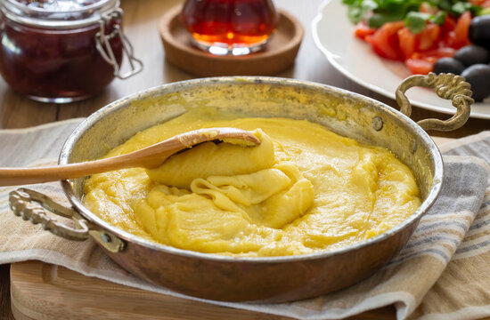 Mihlama (kuymak) is a famous traditional food from Black Sea region in Turkey. It is prepared with corn meal and cheese and served hot.