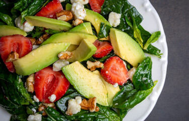 Healthy diet salad; Strawberry Spinach Salad with Avocado.
