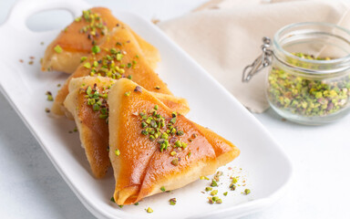 Traditional Turkish desserts; custard triangular dessert, albanian dessert ( Turkish name; Arnavut tatlisi or muhallebili muska tatlisi)