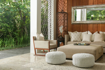 Soft and comfortable sofa with cushions in the lounge area with nice relaxing atmosphere. Cozy...