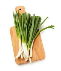 Wooden board with fresh green onion isolated on white background