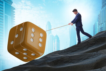Uncertainty concept with businessman and dice
