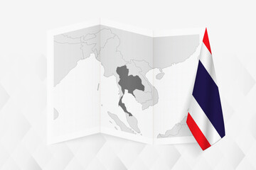 A grayscale map of Thailand with a hanging Thai flag on one side. Vector map for many types of news.