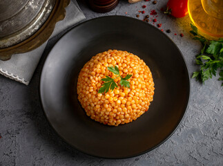Couscous pilaf with tomatoes. Turkish name; domatesli kuskus pilavi