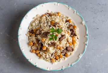 Traditional Turkish food; Roasted meat on rice (Turkish name; pilav üstü kavurma, kurban kavurma, nohutlu etli pilav)