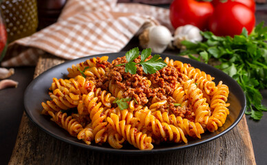 Fusilli pasta, spiral or spirali pasta with tomato, minced  sauce - Italian food style