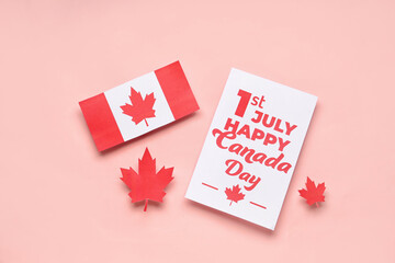 Card with text 1ST JULY HAPPY CANADA DAY, flag and maple leaves on pink background