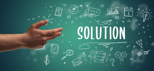 Close-Up of cropped hand pointing at business inscription