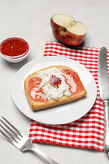 Table setting with tasty toast on white background, closeup. Canadian flag concept