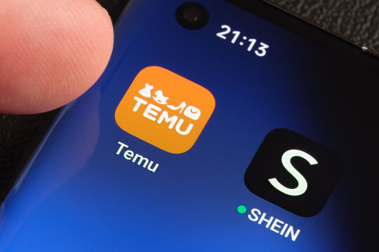TEMU and SHEIN apps seen on the screen of smartphone. Temu app and Shein app are chinese budget shopping platforms. Stafford, United Kindom, May 2, 2023