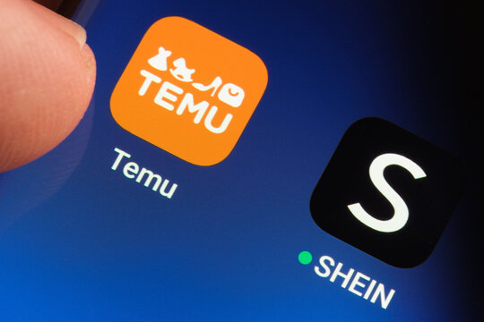 TEMU and SHEIN apps seen on the screen of smartphone. Temu app and Shein app are chinese budget shopping platforms. Stafford, United Kindom, May 2, 2023