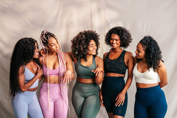 Obraz premium Happy sporty women indoors.