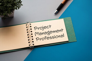 There is notebook with the word Project Management Professional.It is an abbreviation for Project Management Professional as eye-catching image.