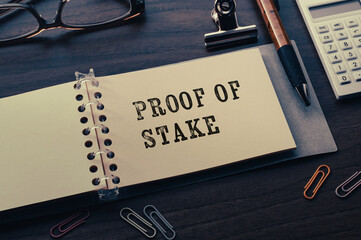 There is notebook with the word Proof of Stake.It is as an eye-catching image.