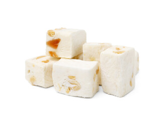 Pieces of delicious nougat on white background