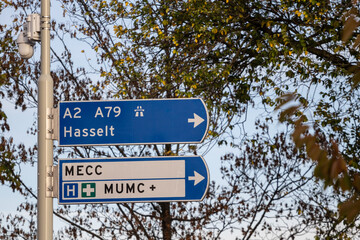 Dutch roadsign in Maastricht, Netherlands, indicating various directions and the way to the highway A2 A79 to Hasselt and the MECC and MUMC hospitals. Netherlands are known for their motorway system.