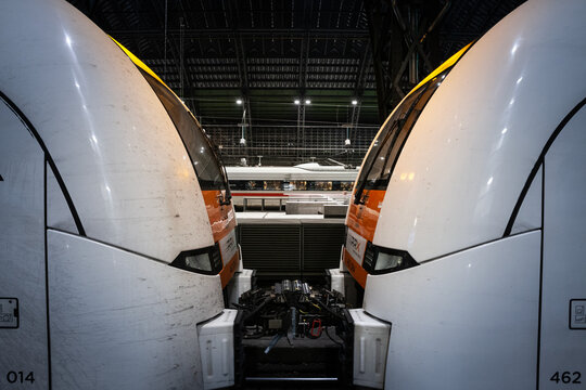 COLOGNE, GERMANY - NOVEMBER 6, 2022: trains on platforms of Cologne Main train station, Koln Hbf Hauptbahnhof, biggest Cologne train station, a RRX Rhein express & an ICE high speed train are visible.