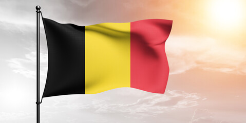 Belgium national flag cloth fabric waving on beautiful sky grey Background.