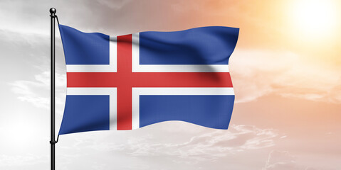 Iceland national flag cloth fabric waving on beautiful sky grey Background.