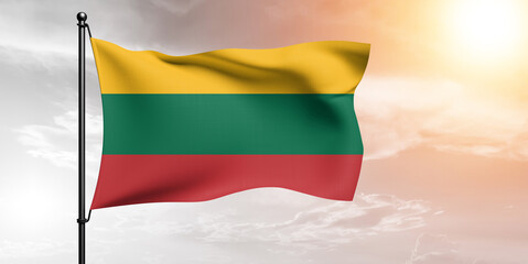 Lithuania national flag cloth fabric waving on beautiful sky grey Background.