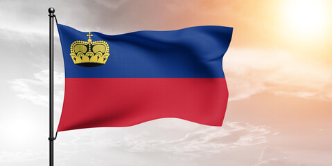 Liechtenstein national flag cloth fabric waving on beautiful sky grey Background.