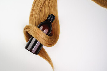 Hair care product and beautiful  Shiny healthy hair. Cosmetics.  Hair mask, shampoo, conditioner.