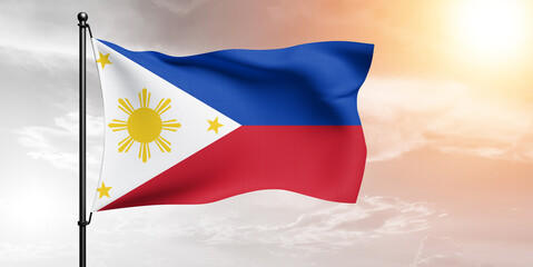 Philippines national flag cloth fabric waving on beautiful sky grey Background.