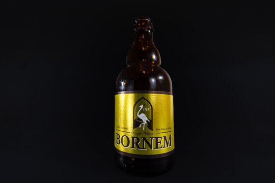 LIEGE, BELGIUM - MARCH 21, 2021: Selective blur on a macro shot of the bottle of a Bornem beer, a tripel triple beer. Bornem is a belgian beer produced by Van Steenberge brewery in Flanders.