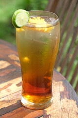 iced tea with mango and lemon slices. refreshment drink.
