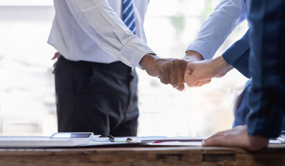 Business team standing hands together, Volunteer charity work. People join for cooperation success...