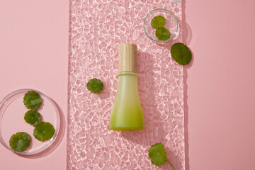 Minimal scene for advertising cosmetics - green bottle unlabeled on transparent acrylic sheet...