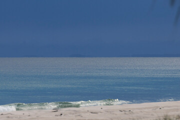 Fototapeta na wymiar beach and blue stormy sky