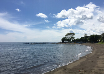 Traditional fishing boats line the shores of Pemuteran beach, bali, Indonesia.
