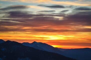 Beautiful mountain theme to use for example as a background. Colorful sunset over the peaks in the Polish Tatra Mountains.