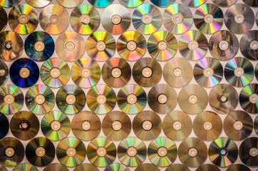 Conceptual old school music background. Background on the wall with old damaged and dirty discs cd.