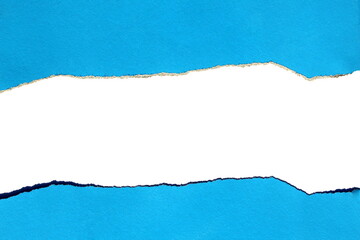 Naklejka premium Torn bright paper on a white isolated background, blue